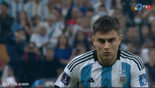 Soccer Player In Blue And White Adidas Jersey Looking At Camera GIF