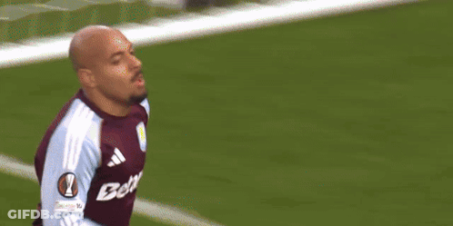 Soccer Player In Blue And White Jersey Celebrating Goal With Teammates GIF