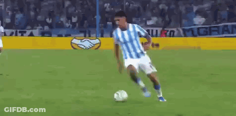Soccer Player In Blue And White Jersey Kicking Ball GIF