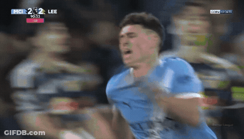 Soccer Player In Blue Jersey Celebrating Goal GIF