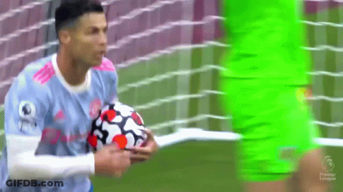 Soccer Player In Blue Jersey Holding Ball GIF