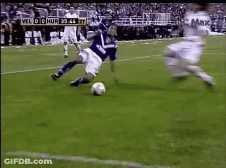 Soccer Player In Blue Jersey Kicking Ball GIF
