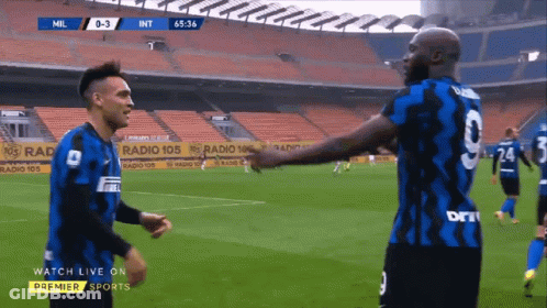 Soccer Player In Blue Jersey Number 9 Celebrating With Fans GIF