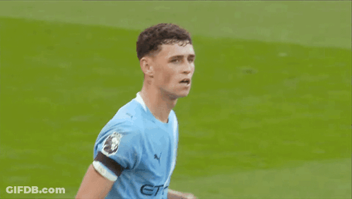 Soccer Player In Blue Jersey Standing On Field GIF