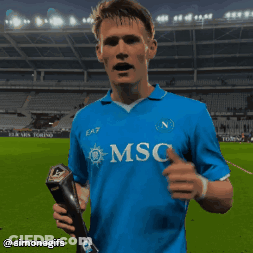 Soccer Player In Blue Msc Shirt Holding Trophy GIF