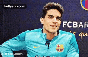 Soccer Player In Blue Nike Jacket Smiling GIF