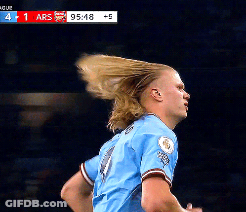 Soccer Player In Blue Pointing Up GIF