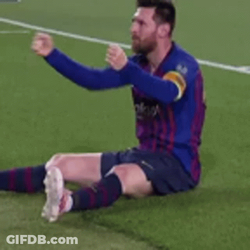 Soccer Player In Blue Shirt Sitting On Grass GIF