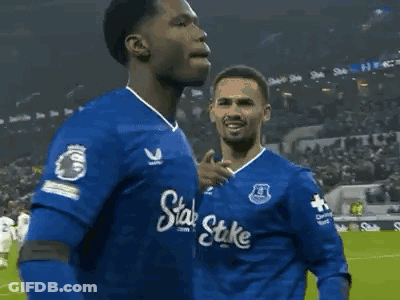 Soccer Player In Blue Shirt With Stake Running GIF