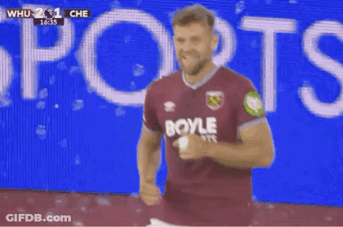 Soccer Player In Burgundy Shirt Celebrating Goal GIF