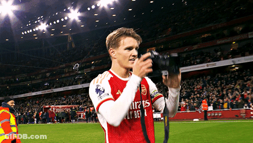 Soccer Player In Emirates Fly Bet Jersey Taking Picture GIF