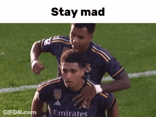 Soccer Player In Emirates Jersey Hugged By Teammate GIF