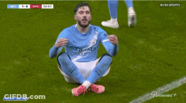 Soccer Player In Etihad Shirt Sitting On Ground GIF