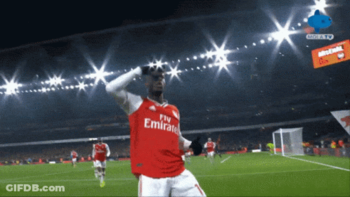 Soccer Player In Fly Emirates Jersey Celebrating Goal GIF