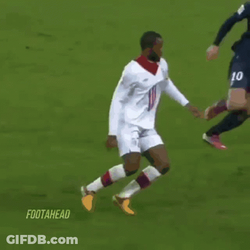 Soccer Player In Fly Emirates Jersey Kicking Ball GIF