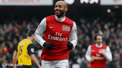 Soccer Player In Fly Emirates Jersey Running GIF