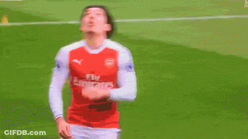 Soccer Player In Fly Emirates Jersey Standing On Field GIF