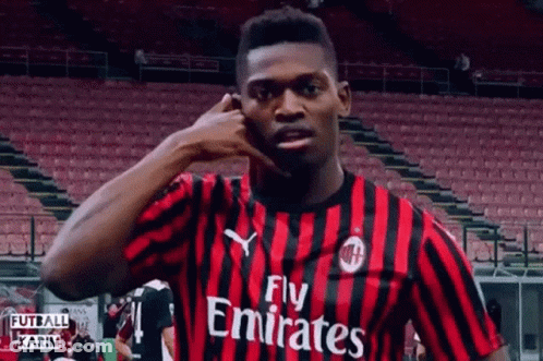 Soccer Player In Fly Emirates Jersey Talking On Phone GIF