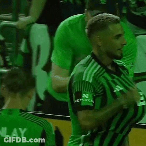 Soccer Player In Green And Black Striped Jersey Thumbs Up GIF