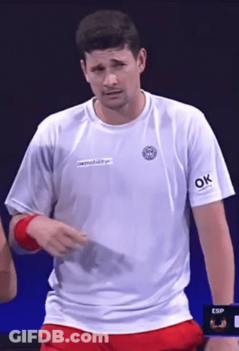 Soccer Player In Green Jersey Kicking Ball Tackled GIF