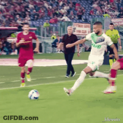 Soccer Player In Green Jersey With Letter E Kicking Ball GIF