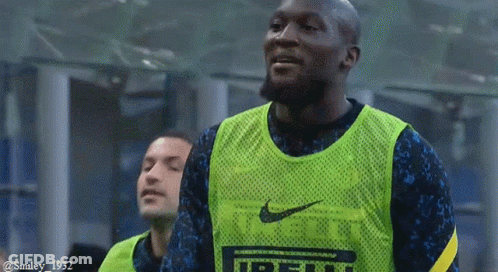 Soccer Player In Green Nike Vest Smiling GIF