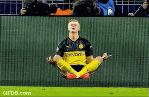 Soccer Player In Lotus Position With Crowd Watching GIF
