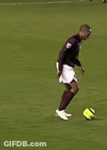 Soccer Player In Maroon Jersey And White Shorts Running GIF