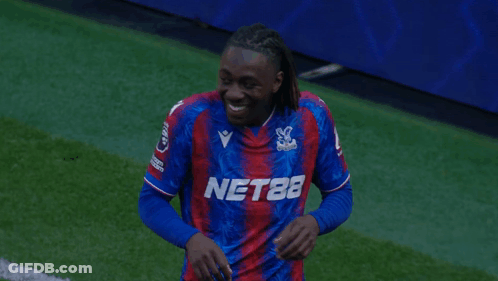 Soccer Player In Nets Jersey Laughing GIF
