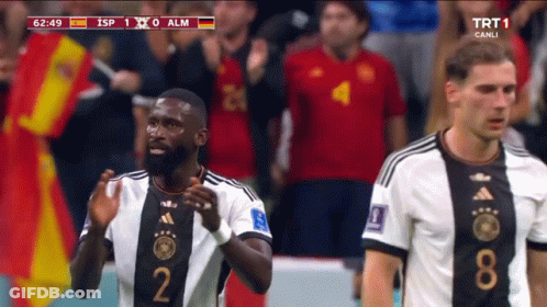 Soccer Player In Number 2 Jersey Next To Another Player GIF