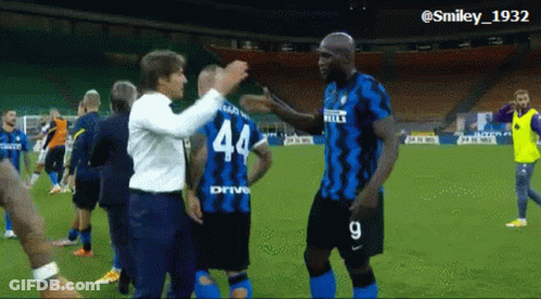 Soccer Player In Number 44 Jersey Hugging Another Player GIF