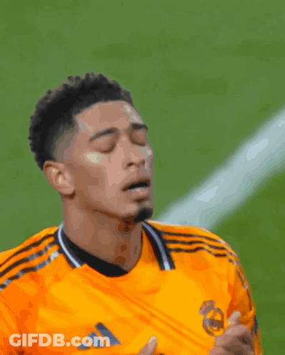 Soccer Player In Orange Adidas Jersey Looking Down GIF