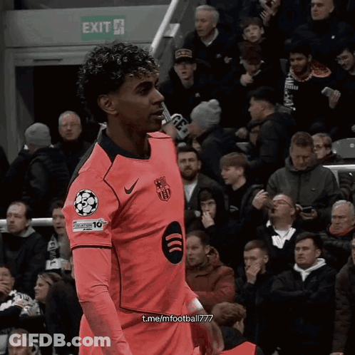 Soccer Player In Pink Jersey Number 10 By Exit Sign GIF