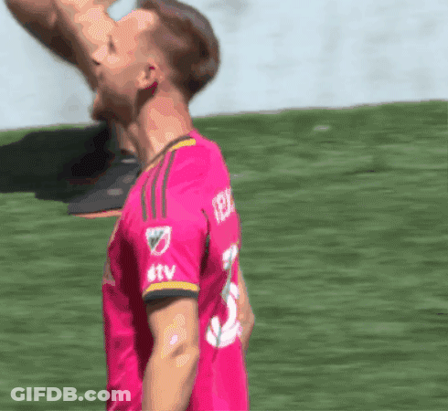 Soccer Player In Pink Jersey With TTV On Sleeve GIF