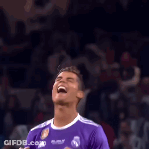 Soccer Player In Purple Fly Emirates Jersey Laughing In Front Of Crowd GIF