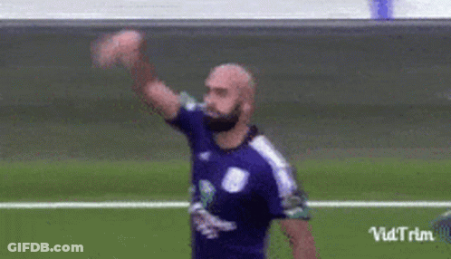 Soccer Player In Purple Shirt Waving GIF