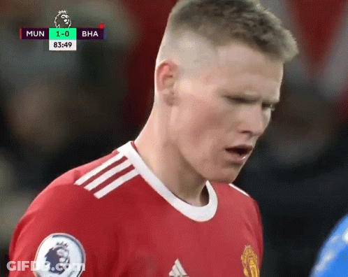 Soccer Player In Red Adidas Jersey Looking Down GIF