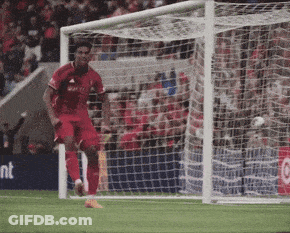 Soccer Player In Red Adidas Jersey Running Towards Goal GIF