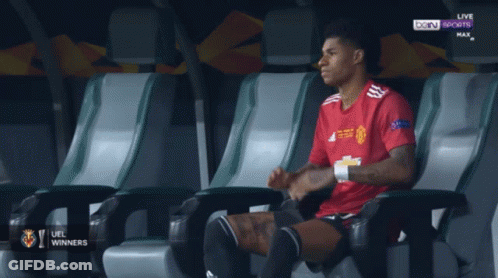 Soccer Player In Red Adidas Looking Down GIF