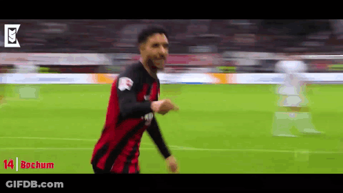 Soccer Player In Red And Black Jersey Running GIF