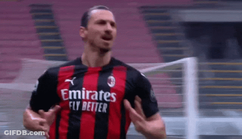 Soccer Player In Red And Black Jersey Saying Emirates Fly Better GIF