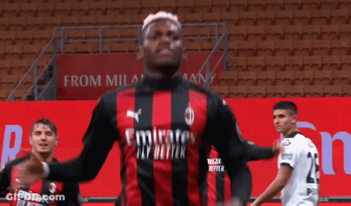 Soccer Player In Red And Black Jersey With Emirates GIF