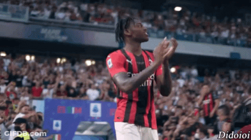 Soccer Player In Red And Black Jersey With Fly Emirates GIF
