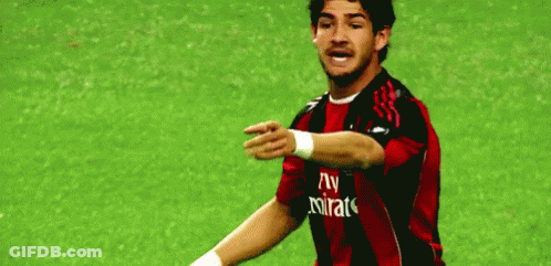 Soccer Player In Red And Black Jersey With Fly Emirates GIF