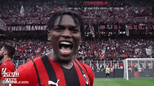 Soccer Player In Red And Black Puma Jersey Screaming GIF