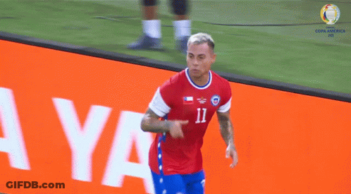 Soccer Player In Red And Blue Jersey Number 12 GIF