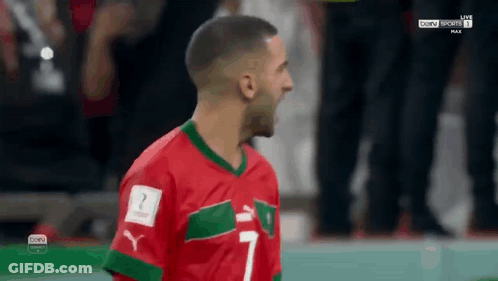 Soccer Player In Red And Green Jersey Number 7 GIF