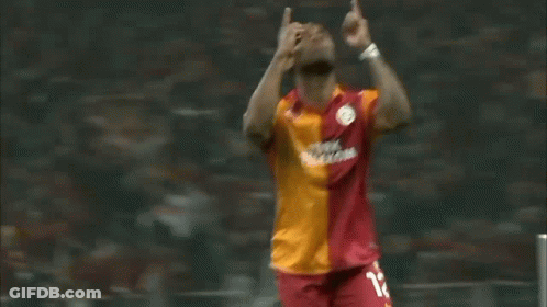 Soccer Player In Red And Orange Jersey Number 12 GIF