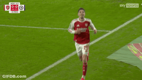 Soccer Player In Red And White Jersey Pointing GIF