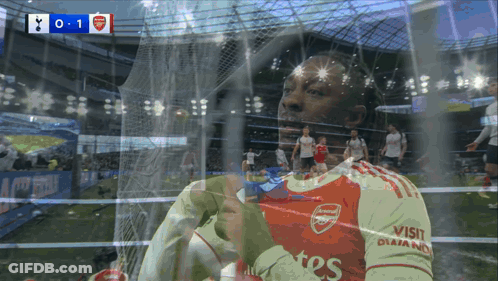 Soccer Player In Red And White Jersey Saying Visit Qatar GIF